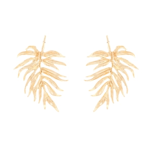 Detailed close-up of golden hollowed-out monstera leaf earrings with a smooth metallic finish