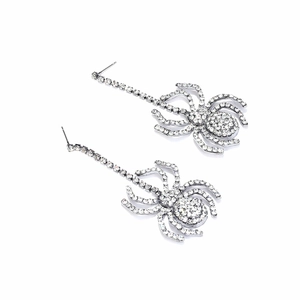 Close-up of sparkling rhinestone spider drop earrings with polished silver finish