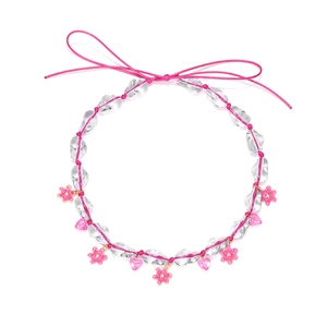Pink handmade beaded necklace with heart pendants and ribbon tie in bohemian style