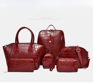 Detailed set of dark red crocodile pattern tote, backpack, and crossbody bags in PU leather