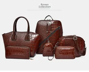 Detailed set of six dark brown crocodile pattern PU leather bags on white background