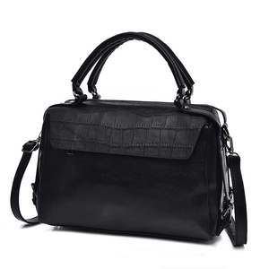 Black Boston handbag with crocodile embossed flap and adjustable shoulder strap for women