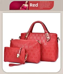 Detailed view of red 3-piece bag set featuring embossed chain patterns and gold hardware