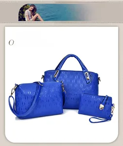 Three-piece electric blue handbag set with embossed chain pattern and gold hardware