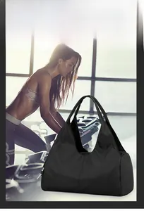 Detail of a black high-capacity gym bag with wet/dry separation and shoe compartment