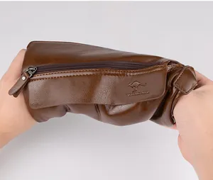 Detail of soft brown pebble leather cross-body bag showing flexibility and kangaroo logo