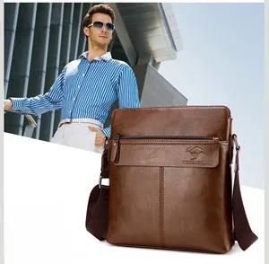 Detailed view of brown men's shoulder bag with lychee texture and kangaroo logo