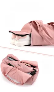 Pink fitness bag with separate shoe compartment and multiple storage pockets