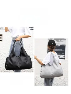 Minimalist large capacity tote bag shown in black and light grey for fitness and travel