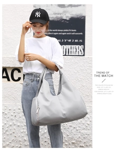 Light gray waterproof nylon sports bag with side zipper pocket for travel and yoga