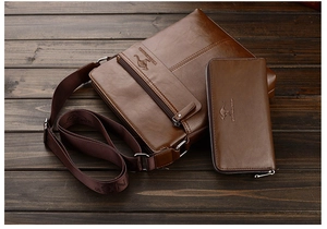 Detailed view of men's brown PU leather crossbody bag and matching wallet on wood