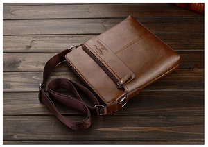 Close-up of brown leather texture and embossed kangaroo logo on men's shoulder bag