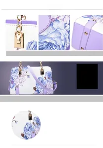 Close-up of purple floral print on white leather and golden metal hardware details