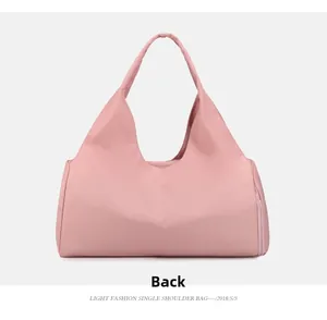 Rear view of pink waterproof fitness tote bag showing high-density nylon material