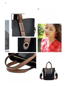 Detail view of black faux leather tote with brown handles and TAO woven shoulder strap