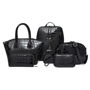 Black crocodile embossed 5-piece handbag set featuring tote, backpack, and wallets
