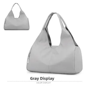 Detail of grey waterproof gym bag showing two angles and durable fabric texture