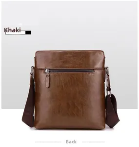 Back view of men's brown crossbody bag featuring litchi texture and metal zipper