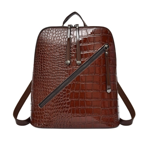 Brown crocodile embossed faux leather backpack for women featuring glossy finish and metal zippers