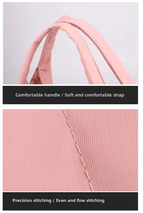 Detail of pink fitness bag showing reinforced soft handles and precision stitching