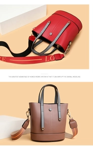 Detail view of stylish bucket handbags in red and brown with wide patterned shoulder straps