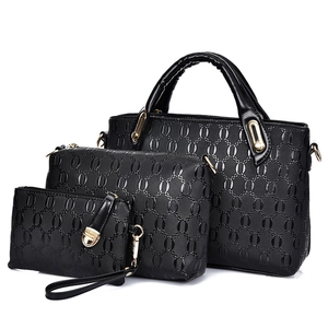 Three-piece black fashion handbag set with chain texture and golden hardware accents
