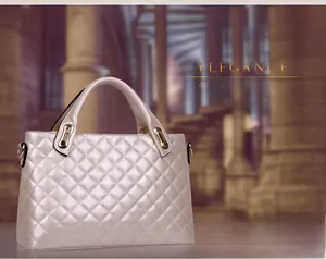 Detail of elegant champagne quilted shoulder bag with premium gold hardware accents
