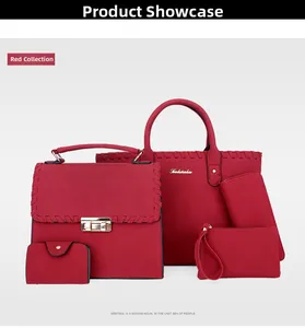 Macro shot of 5-piece red faux suede handbag set featuring gold locks and woven stitch details