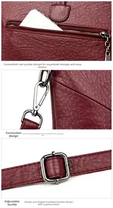 Détail du sac bandoulière bordeaux avec texture litchi et boucle en métal brillant