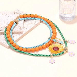 Collana a strati con ciondoli girasole farfalla e catena in corda con margherite