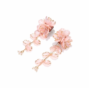 Handmade pink flower tassel earrings with gold-rimmed petals and pearl beads on mirror base