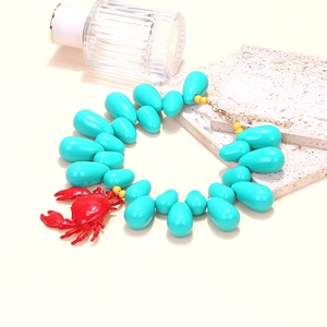 Handmade summer ocean necklace with large turquoise beads and a red crab pendant