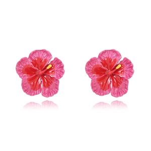 Macro shot of gradient red Frangipani floral earrings with detailed yellow stamens