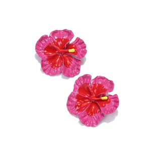 Macro detail of Frangipani floral earrings with pink gradient enamel and yellow stamen