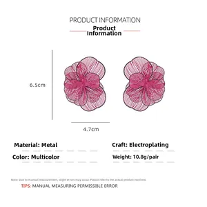 Detail view of large magenta floral earrings showing 6.5cm height and 4.7cm width dimensions