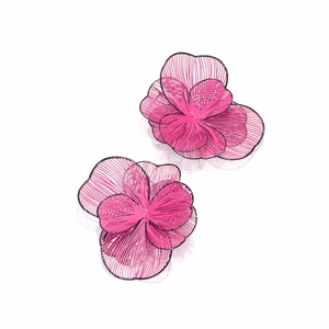 Macro detail of 3D layered pink flower earrings with metallic textures and radiant petals