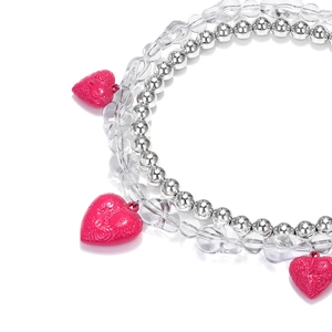 Multilayer beaded necklace with silver spheres, clear beads, and pink floral heart pendant