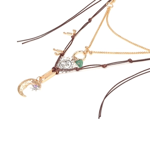 Bohemian multilayer necklace with gold sun moon star pendants and green stone