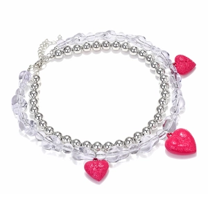 Detail of double-layer beaded necklace with vibrant pink heart charms and silver beads