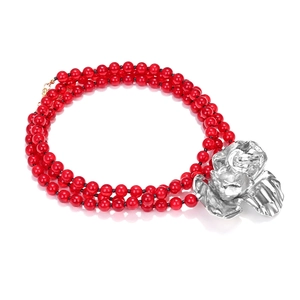 Three-layer red beaded necklace featuring a large metallic silver rose floral pendant