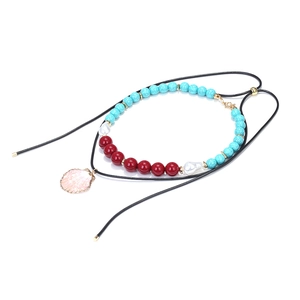 Bohemian multilayer beaded necklace featuring blue turquoise, pearls and a pink shell pendant