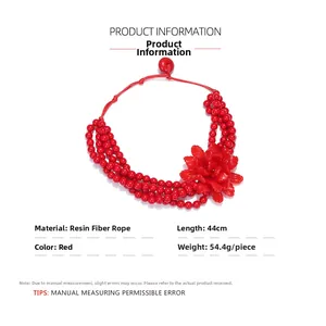 Detail view of red multi-layer resin beaded necklace with floral element and measurements