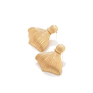 Detailed close-up of gold-plated fish tail earrings with fine pleated metal texture
