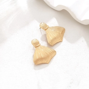 Elegant vintage gold fishtail earrings with radiant pleated texture in a matte finish
