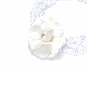 Elegant multi-layer pearl necklace with a large white fabric camellia flower charm