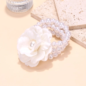Bohemian multilayer pearl bracelet with a large white fabric flower charm and beads