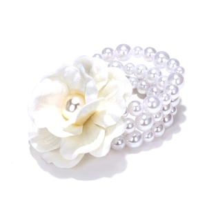 Bohemian multilayer faux pearl bracelet with a large white fabric flower for weddings