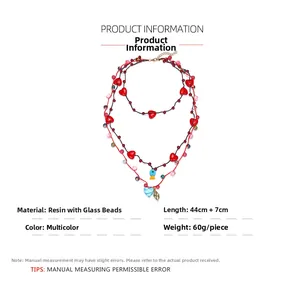 Spécifications de l'ensemble collier multicouche avec pendentifs cœur et poisson bleu