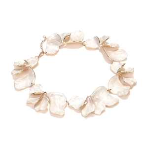 Exaggerated handmade white petal necklace with gold trim and enamel leaf details