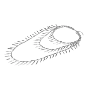 Close-up of triple-layered silver necklace with delicate metallic leaf pendants